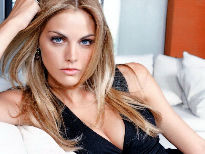 Woman with Blonde Hair — Confident, Photograph, Black Top, White Couch