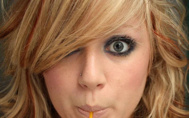 woman with blonde hair drinking