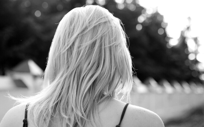 woman with blonde hair from behind