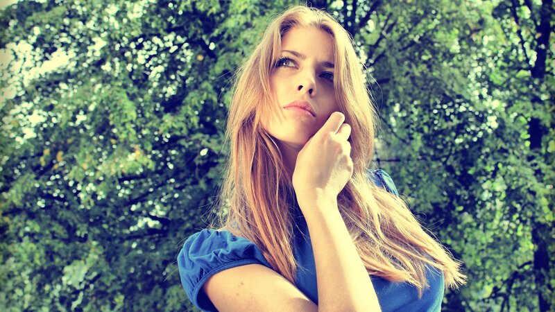Woman with Blonde Hair — Green, Contemplative, Afternoon, Photograph, Trees, Blue Shirt