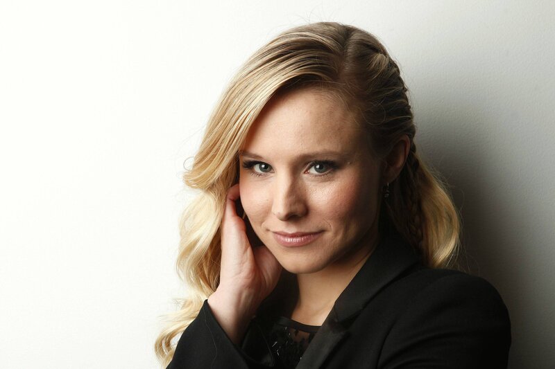 woman with blonde hair in a black blazer