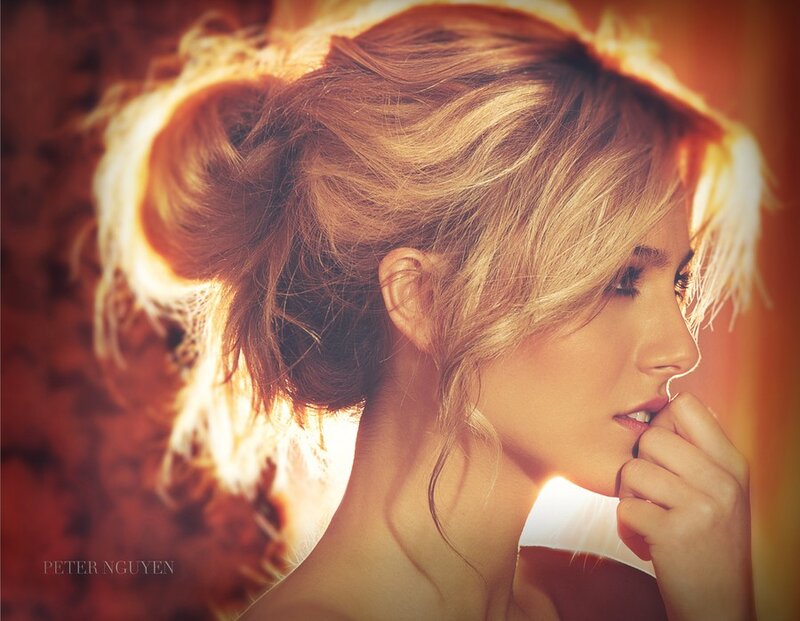 woman with blonde hair in a bun