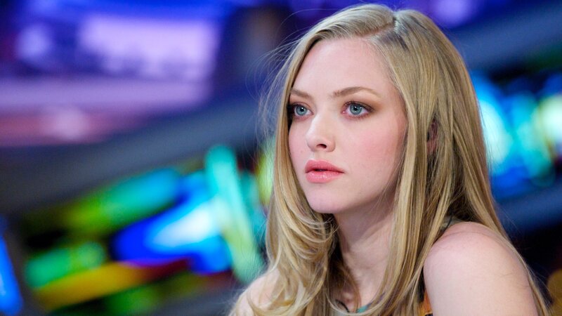 woman with blonde hair in a colorful setting