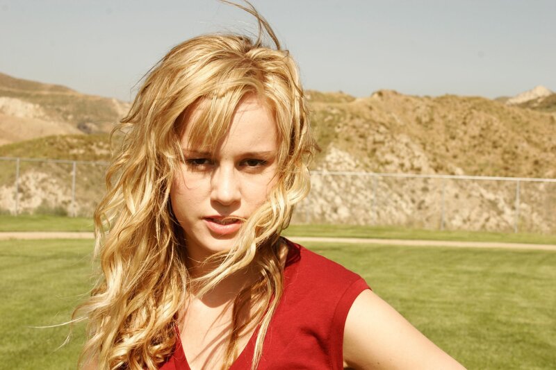 woman with blonde hair in a field