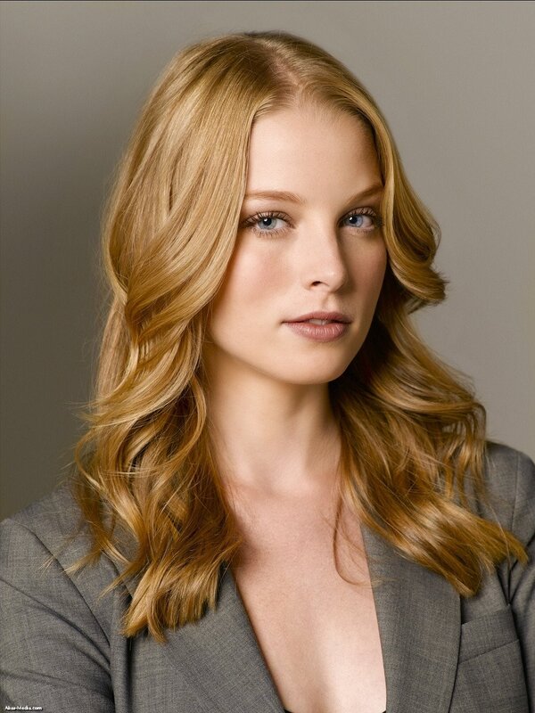 woman with blonde hair in a grey blazer