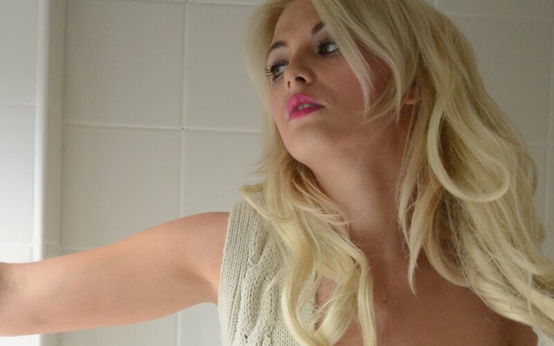 woman with blonde hair in bathroom