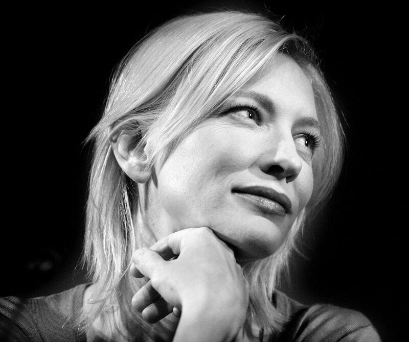 woman with blonde hair in black and white