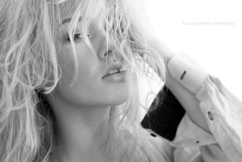 woman with blonde hair in black and white