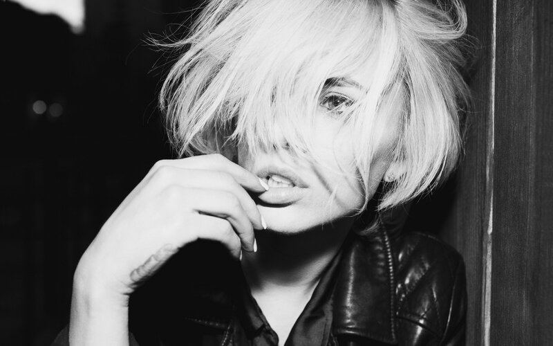 woman with blonde hair in black and white