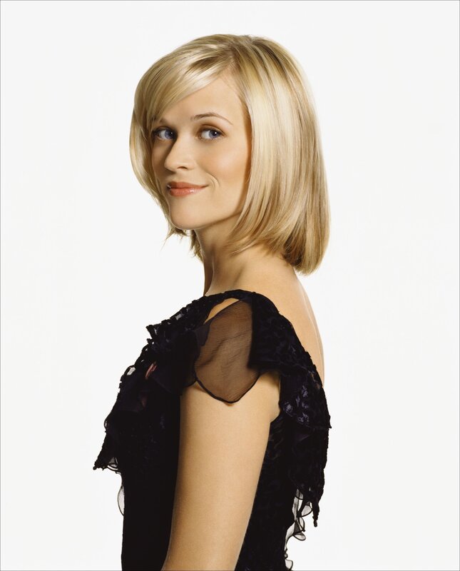 woman with blonde hair in black dress