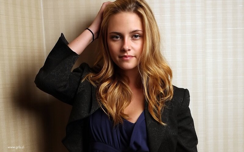 woman with blonde hair in black jacket