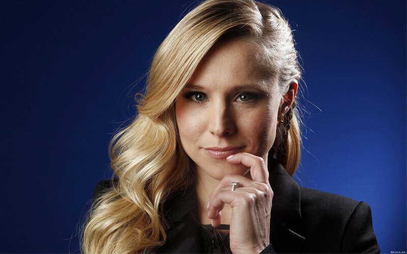 woman with blonde hair in black jacket