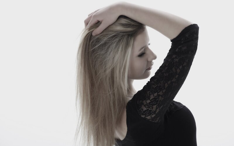 woman with blonde hair in black lace