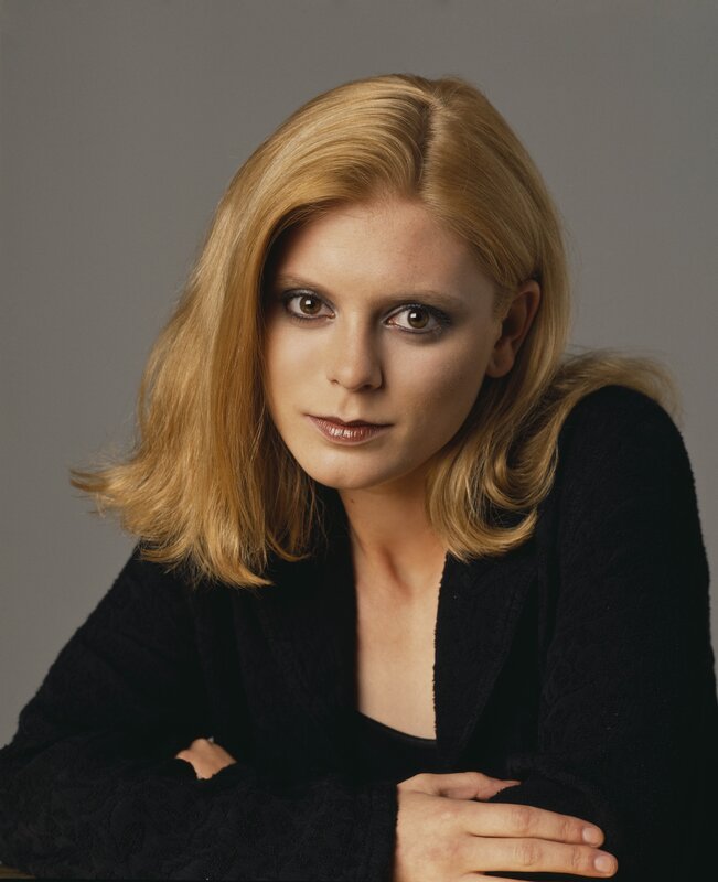 woman with blonde hair in black sweater