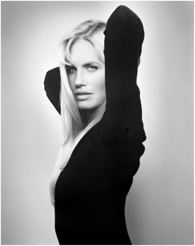 woman with blonde hair in black sweater