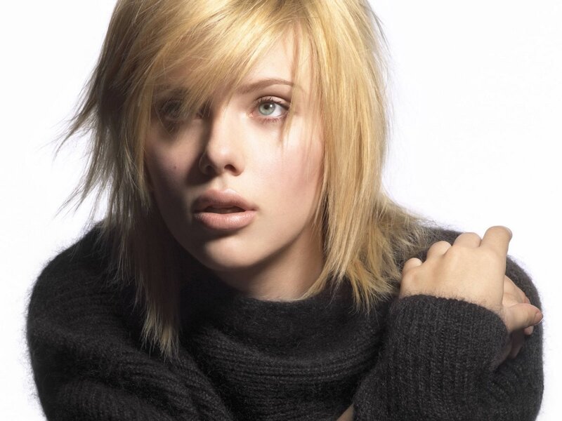 woman with blonde hair in black sweater