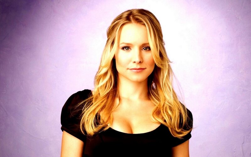 woman with blonde hair in black top