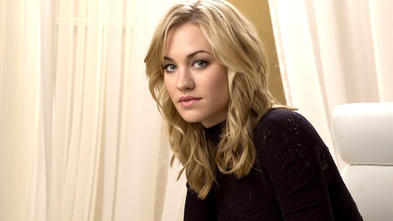 woman with blonde hair in black top
