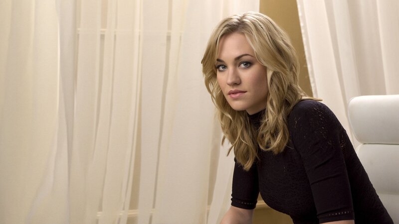 woman with blonde hair in black top