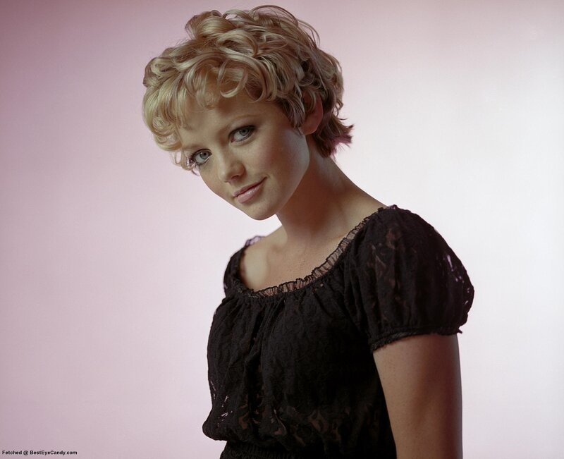 woman with blonde hair in black top
