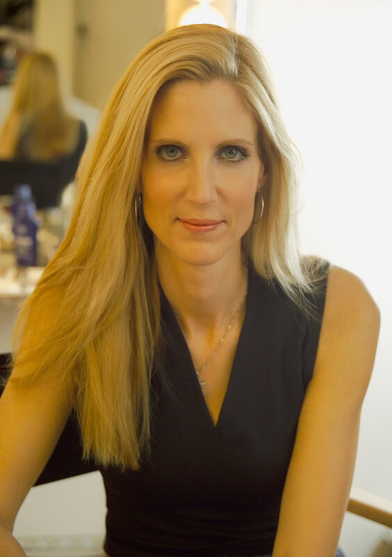 woman with blonde hair in black top