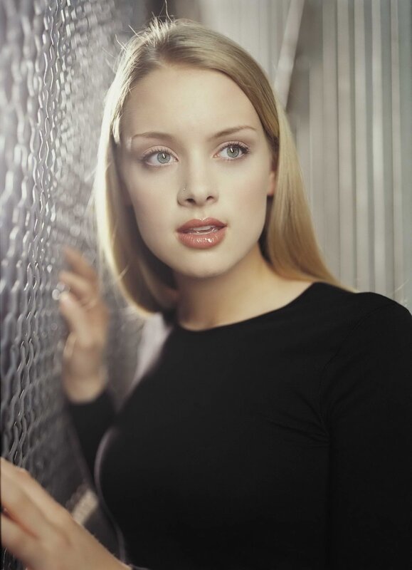 woman with blonde hair in black top