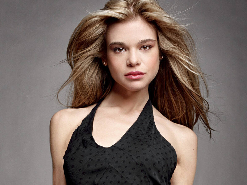 woman with blonde hair in black top