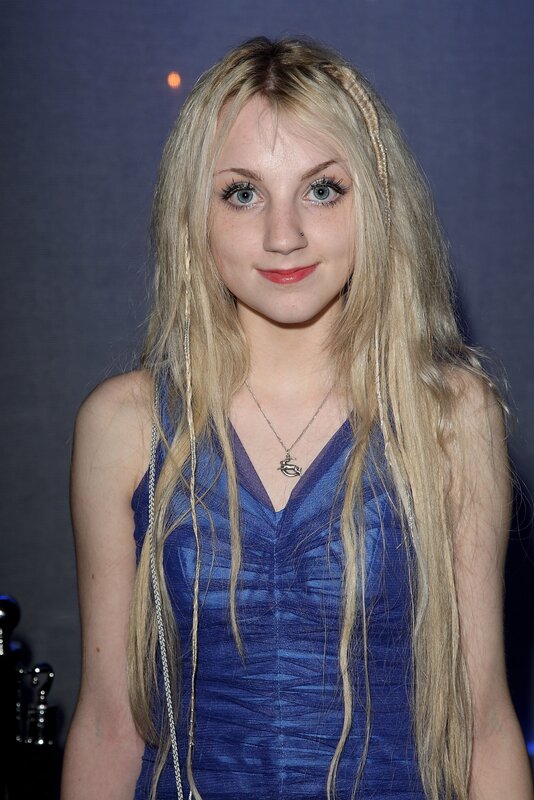 woman with blonde hair in blue dress