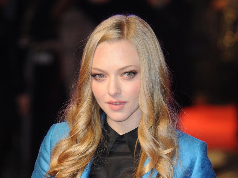 woman with blonde hair in blue jacket