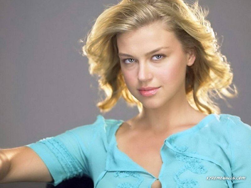 woman with blonde hair in blue top