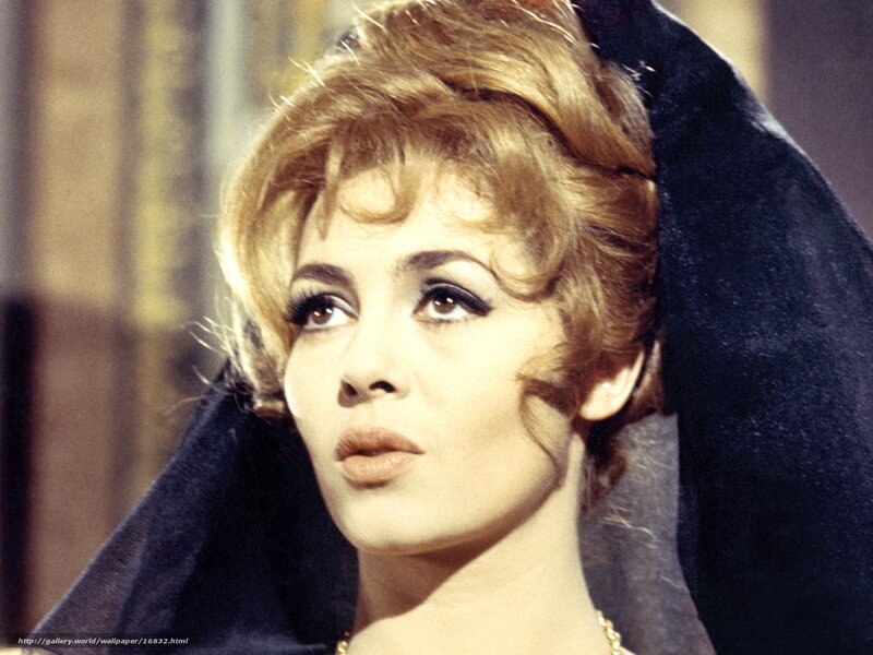 woman with blonde hair in dark cloak