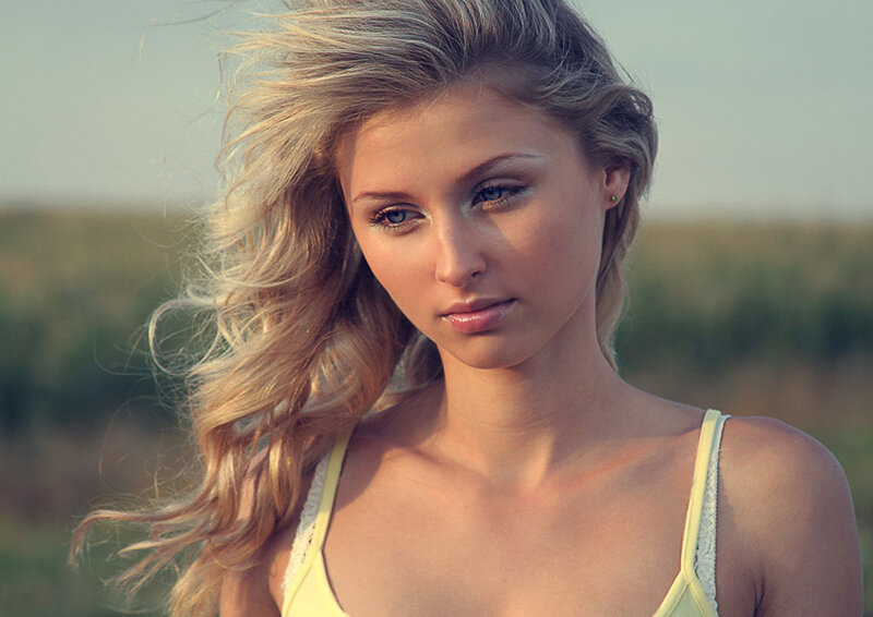 woman with blonde hair in field