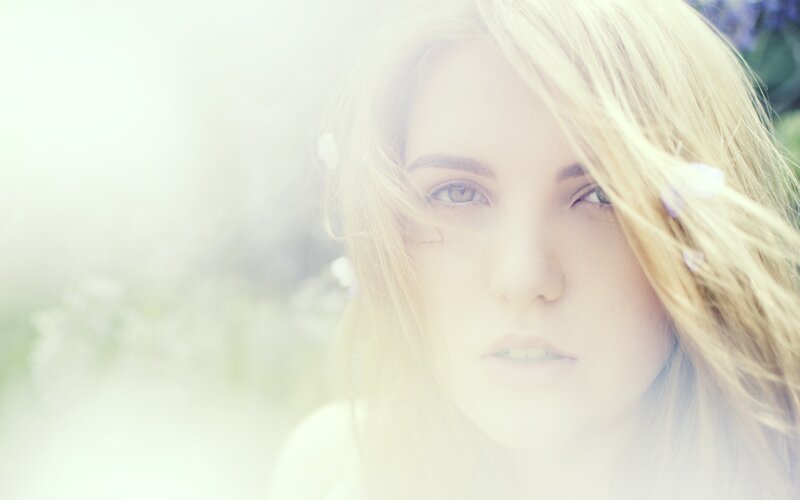 woman with blonde hair in field