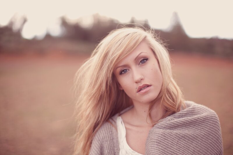 woman with blonde hair in field