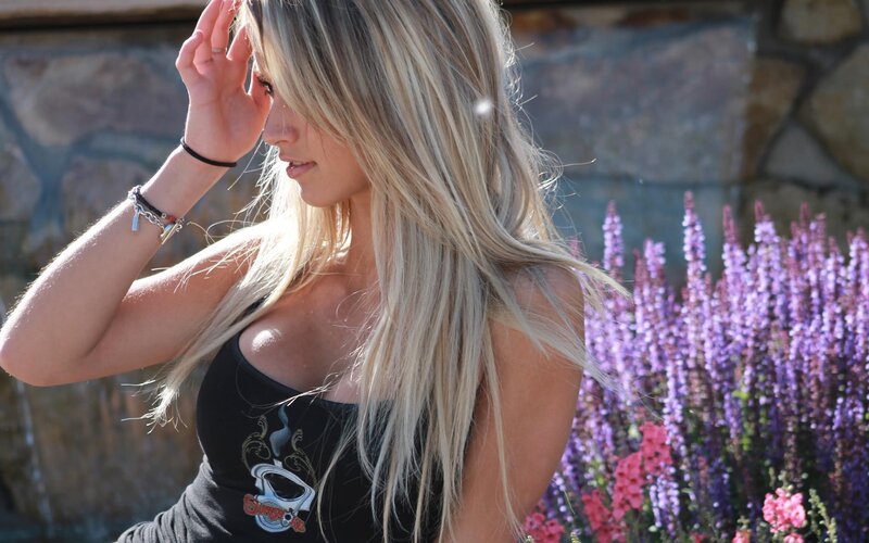 woman with blonde hair in garden