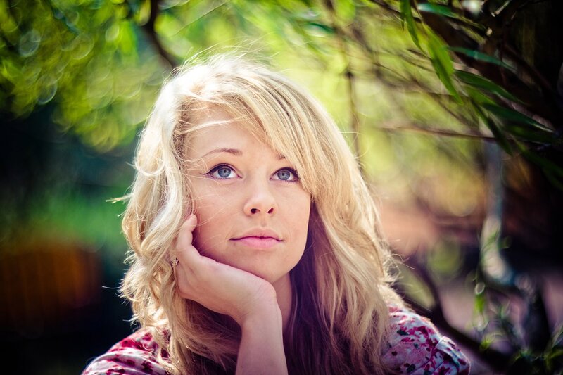 woman with blonde hair in garden