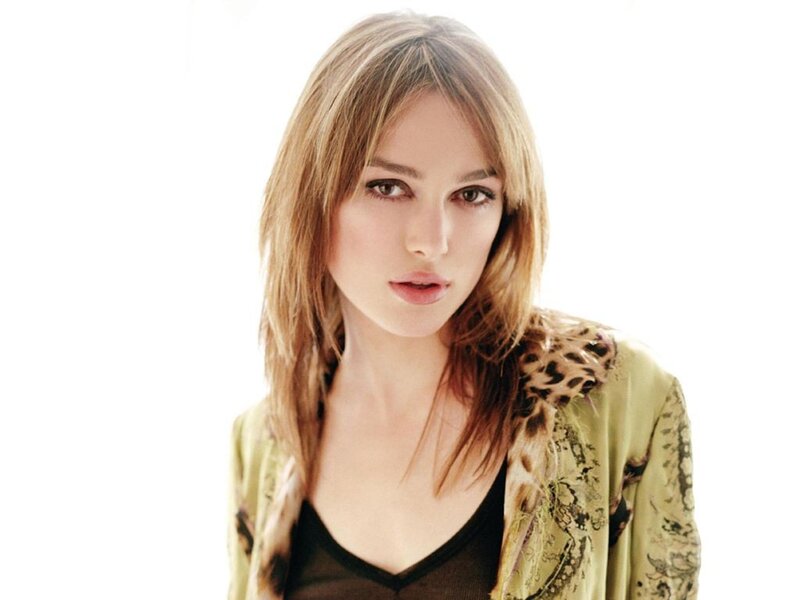 woman with blonde hair in green jacket