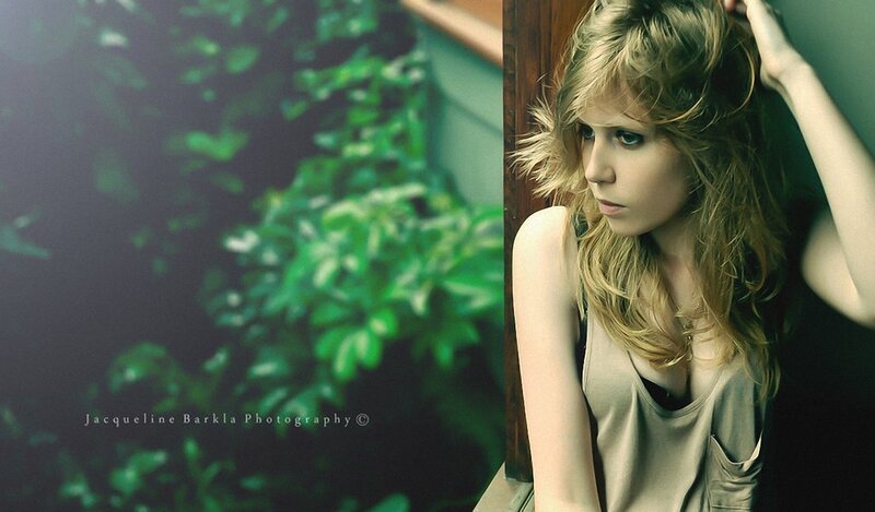 woman with blonde hair in green setting