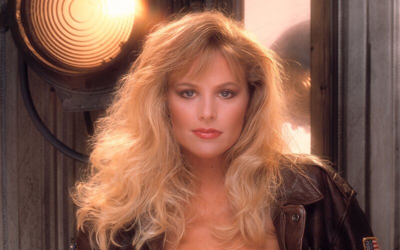 woman with blonde hair in leather jacket