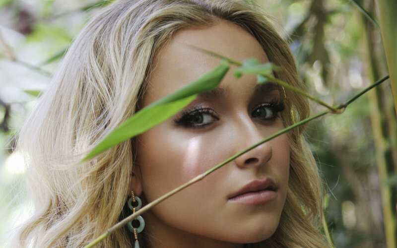 woman with blonde hair in nature