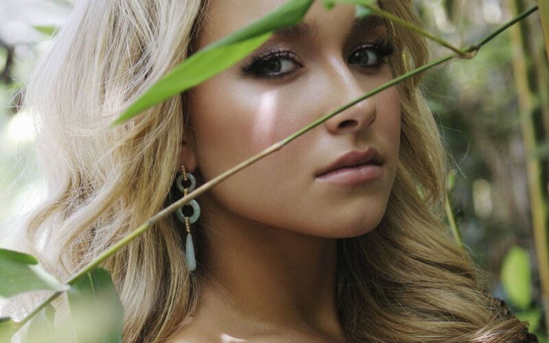 woman with blonde hair in nature