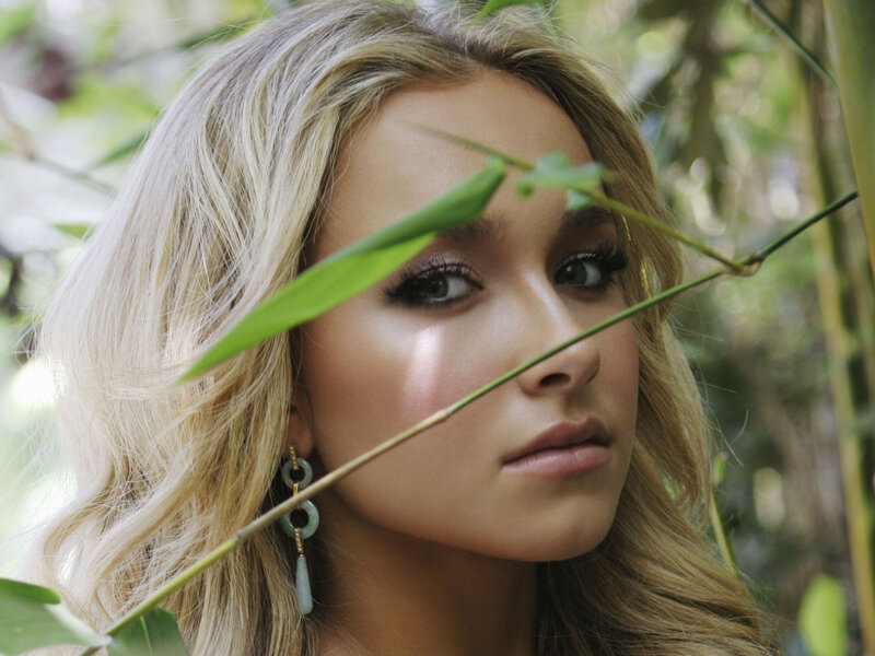 woman with blonde hair in nature