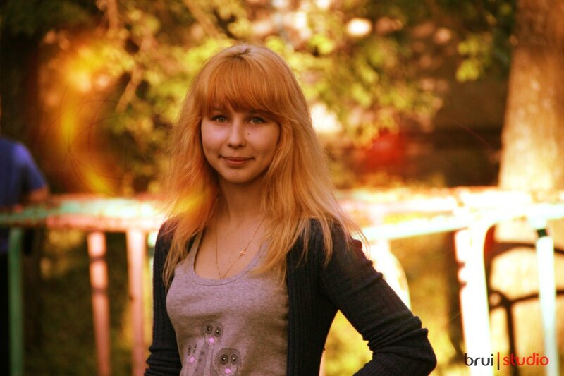 woman with blonde hair in park