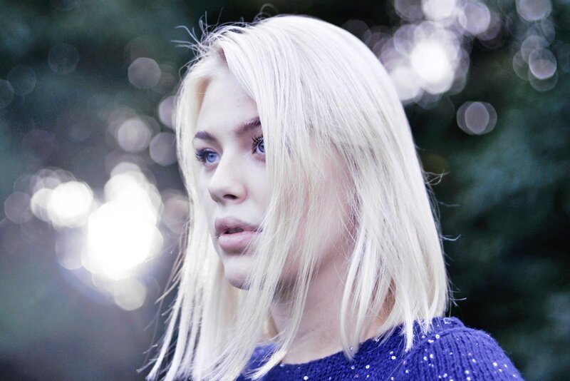 woman with blonde hair in park