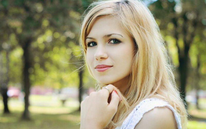woman with blonde hair in park