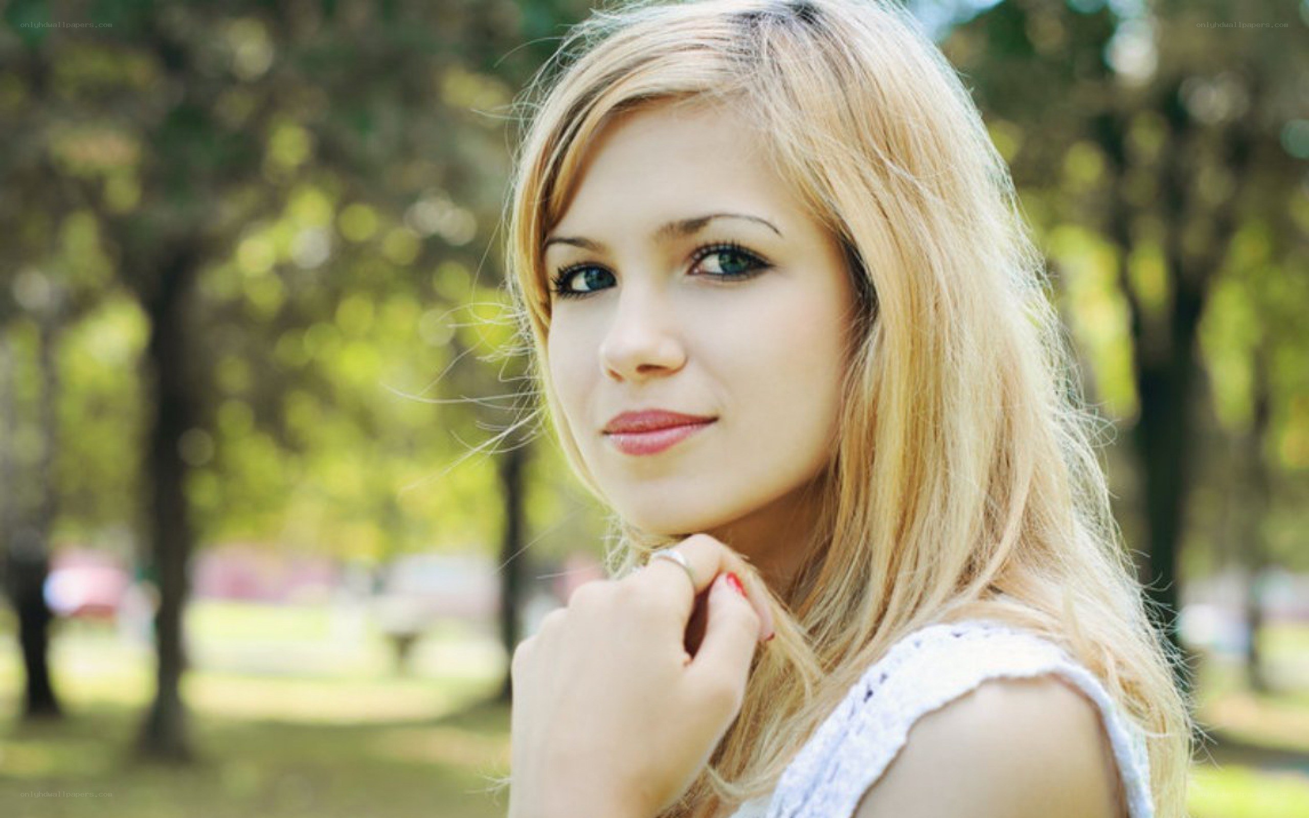 woman with blonde hair in park