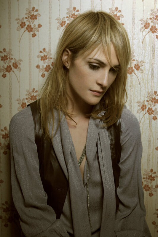 woman with blonde hair in patterned room