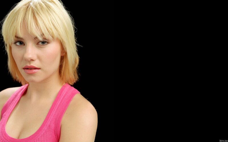 woman with blonde hair in pink top