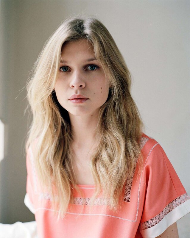 woman with blonde hair in pink top