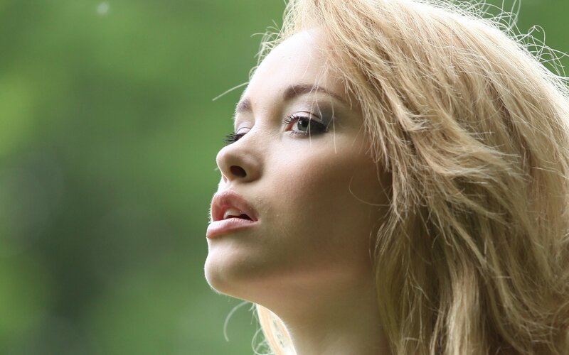 woman with blonde hair in profile